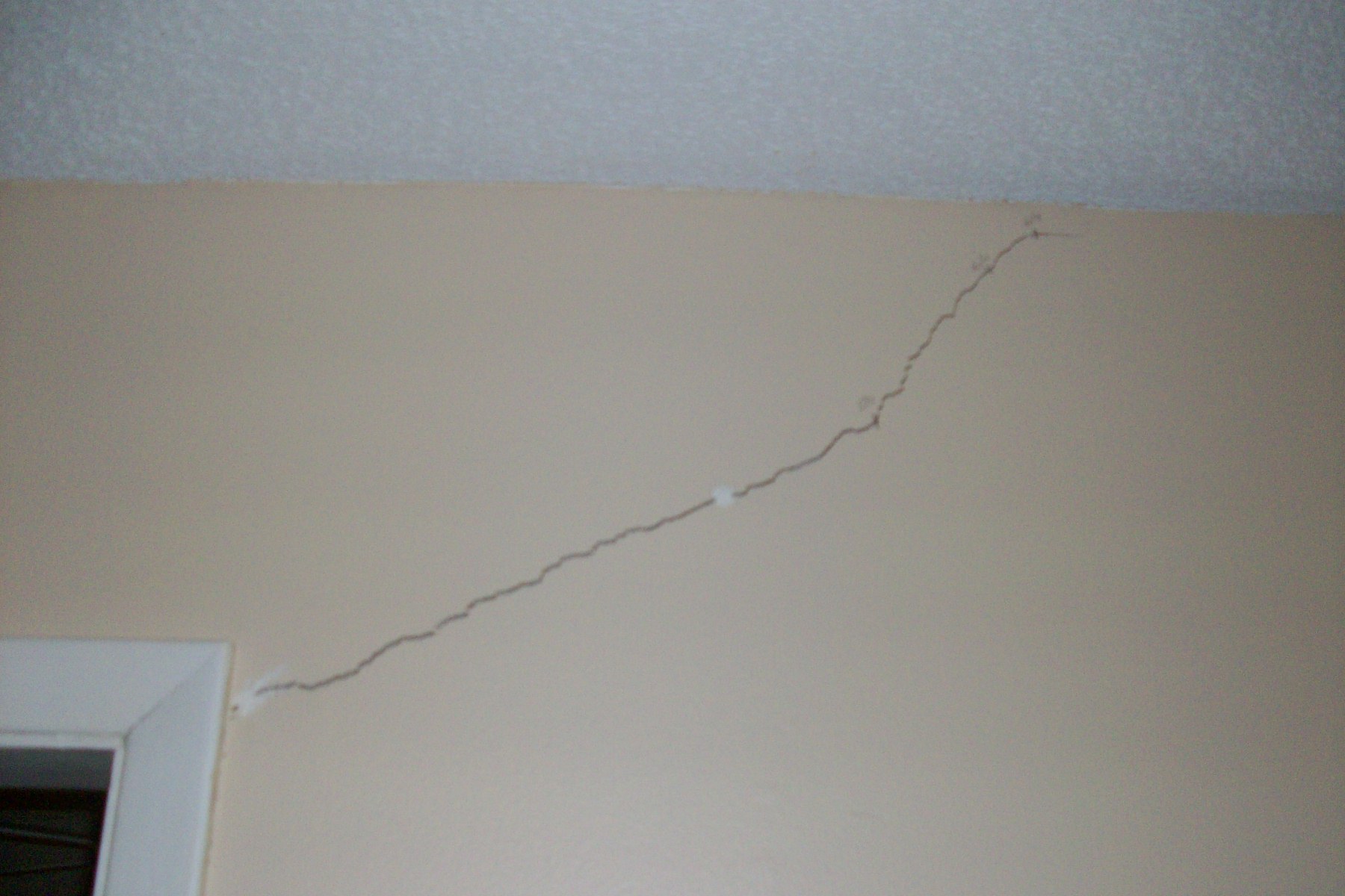Cracks over the door frame. Sinkhole house Deltona Florida.